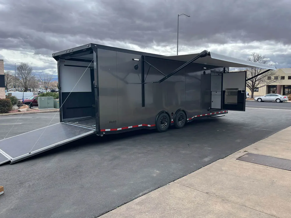 8.5 x 28 ATC ROM 550 Sport/Car Hauler Med Charcoal Awning and Doors Open