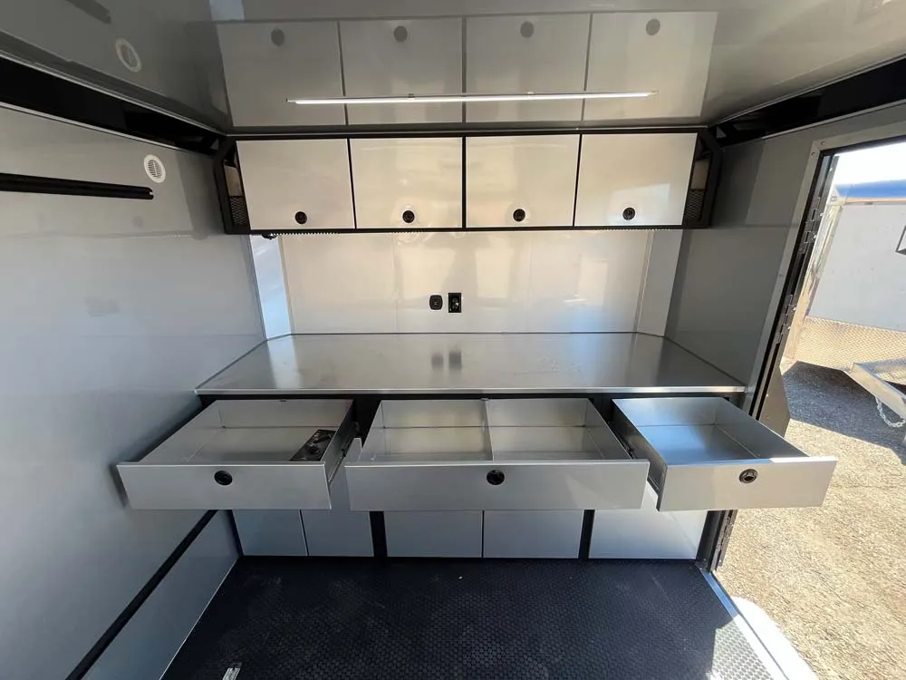 8.5 x 20 ATC STO 450 Cargo Trailer Tandem Silver Frost front cabinet drawers